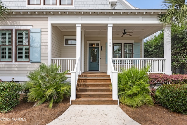 doorway to property featuring ceiling fan and covered porch