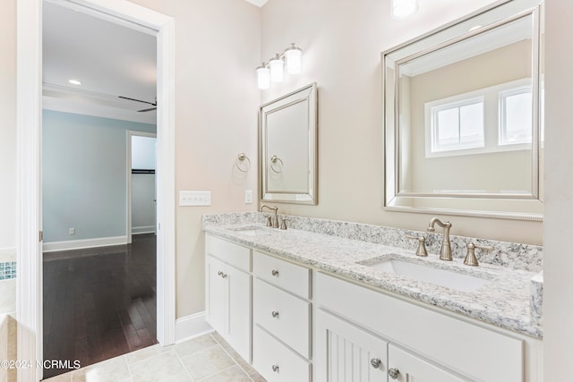 bathroom with ceiling fan, vanity, and hardwood / wood-style floors