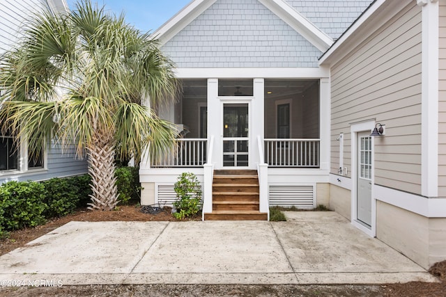 doorway to property with a patio