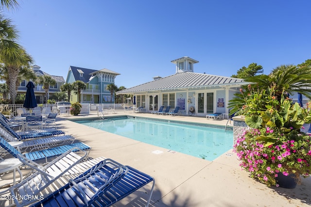 1230 Pinfish Ln, Carolina Beach, NC 28428 - community pool with a patio and french doors