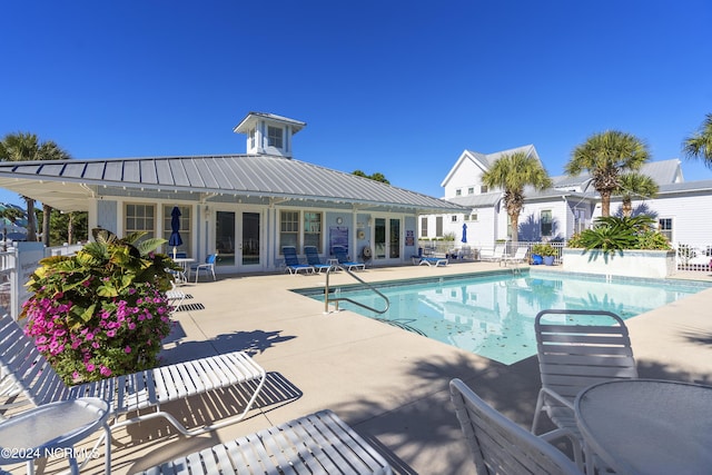 1230 Pinfish Ln, Carolina Beach, NC 28428 - community pool featuring french doors and a patio