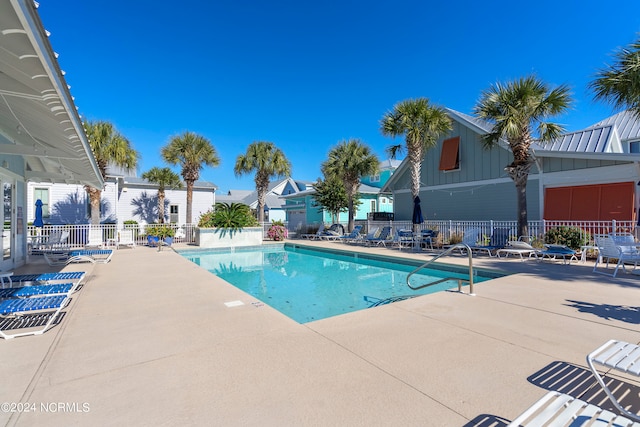 view of swimming pool with a patio area