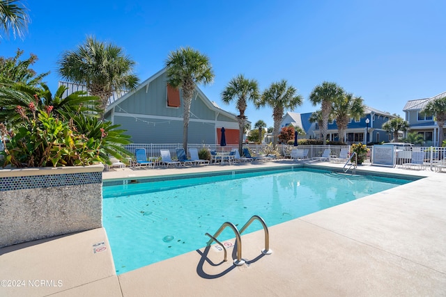 view of swimming pool featuring a patio area