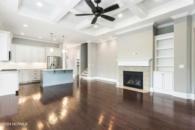 unfurnished living room with ornamental molding, beamed ceiling, coffered ceiling, and dark wood-type flooring