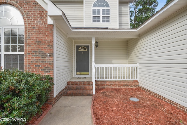 entrance to property with a porch