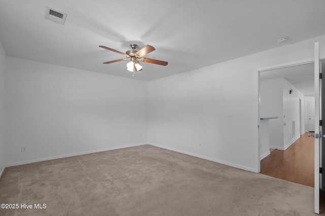 633 Spencer Farlow Dr Unit 12, Carolina Beach, NC 28428 - spare room with ceiling fan, carpet flooring, and baseboards