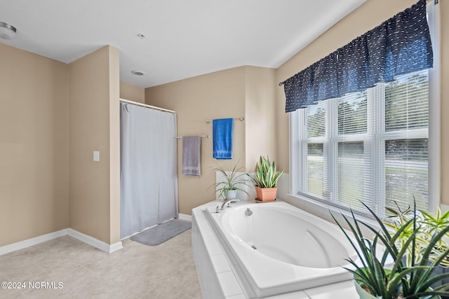 bathroom featuring independent shower and bath