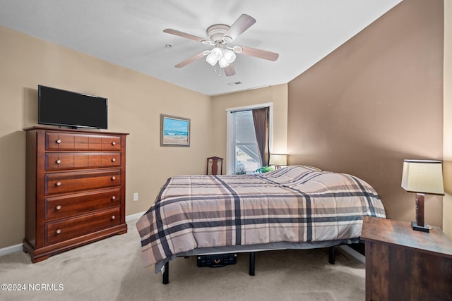 bedroom featuring ceiling fan and light colored carpet