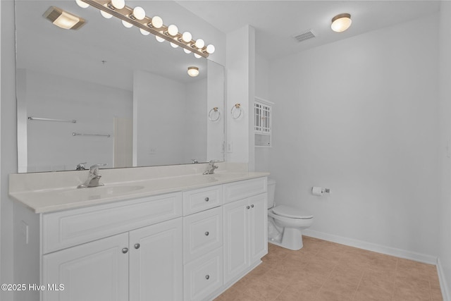 633 Spencer Farlow Dr Unit 12, Carolina Beach, NC 28428 - full bath featuring toilet, double vanity, baseboards, and tile patterned floors
