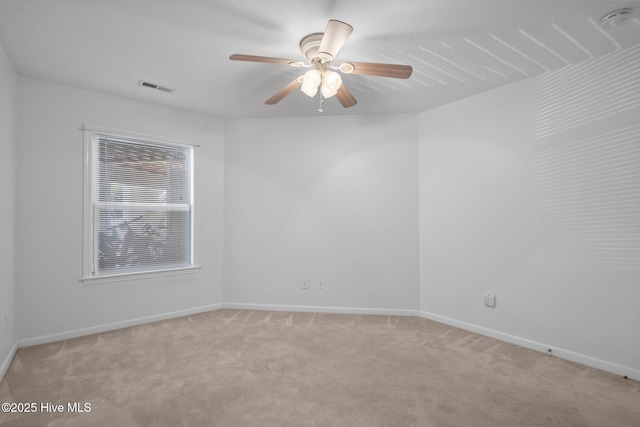 633 Spencer Farlow Dr Unit 12, Carolina Beach, NC 28428 - unfurnished room featuring light carpet, ceiling fan, a smoke detector, and baseboards