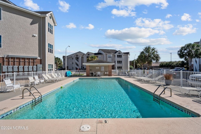 view of pool featuring a patio