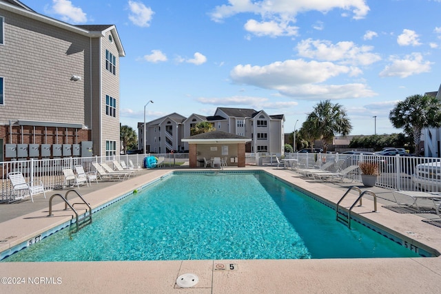 633 Spencer Farlow Dr Unit 12, Carolina Beach, NC 28428 - community pool featuring fence and a patio