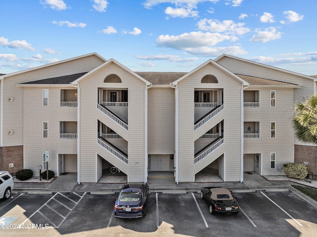 633 Spencer Farlow Dr Unit 12, Carolina Beach, NC 28428 - view of property featuring uncovered parking
