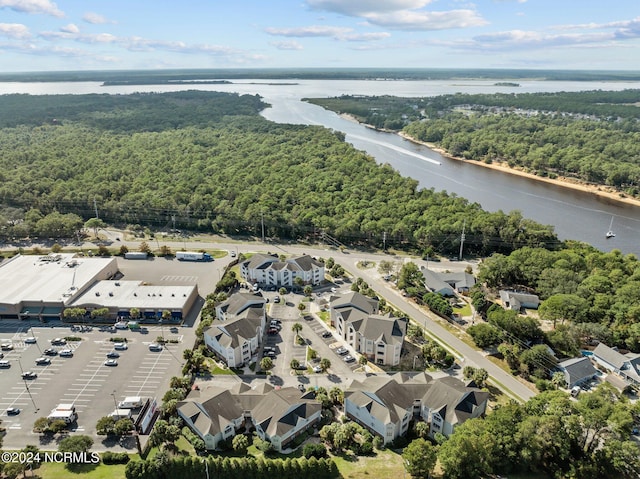 633 Spencer Farlow Dr Unit 12, Carolina Beach, NC 28428 - aerial view of property and surrounding area featuring a heavily wooded area and a nearby body of water