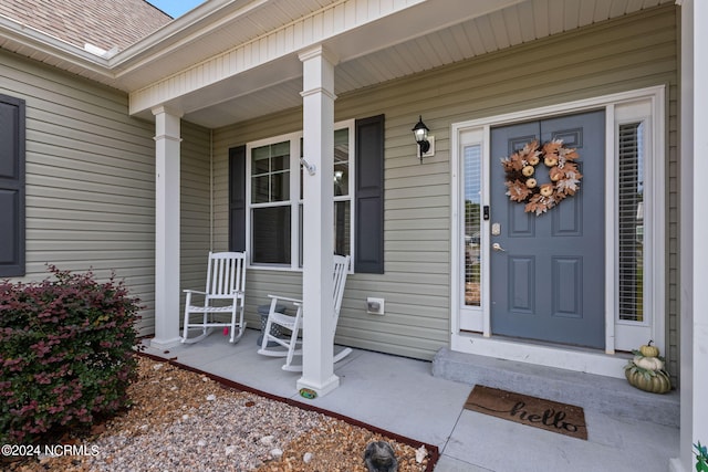 doorway to property with a porch