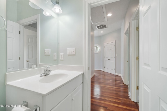 bathroom with vanity and wood-type flooring