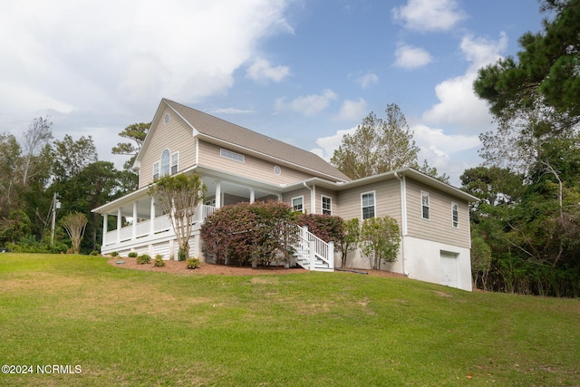 499 Ward Rd, Swansboro, NC 28584 - view of front of property with a porch, a front yard, stairway, and a garage