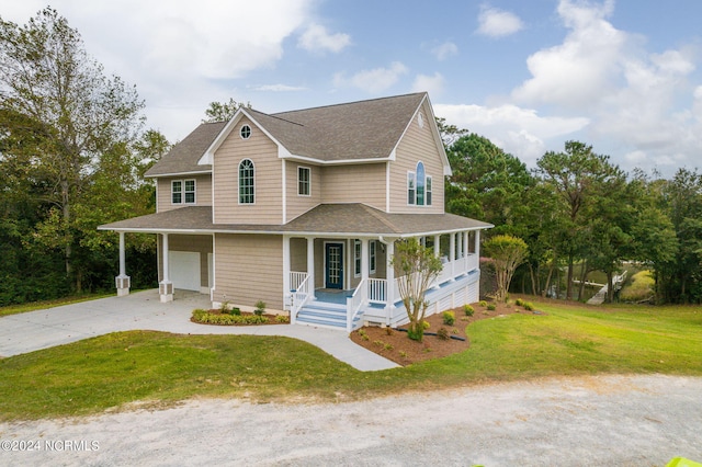 farmhouse featuring a front yard, a garage, and a porch