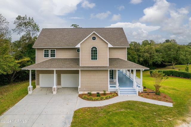 farmhouse featuring a front yard, covered porch, and a garage