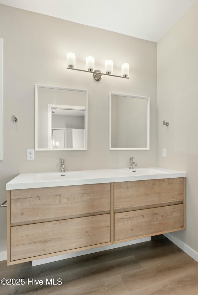 bathroom featuring hardwood / wood-style floors and vanity