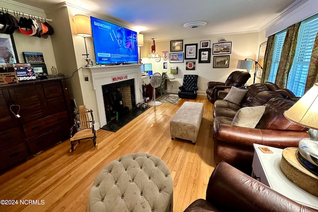 living room featuring ornamental molding and hardwood / wood-style flooring