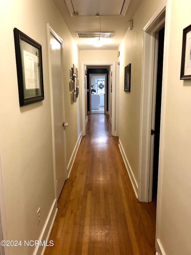 hallway featuring hardwood / wood-style floors