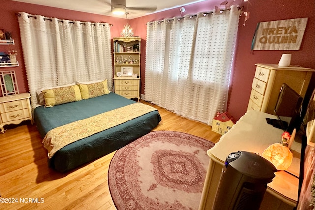 bedroom featuring ceiling fan and hardwood / wood-style floors