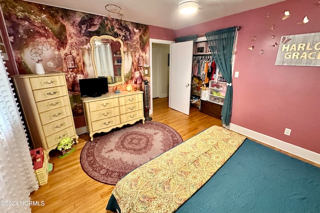 bedroom featuring hardwood / wood-style flooring and a closet