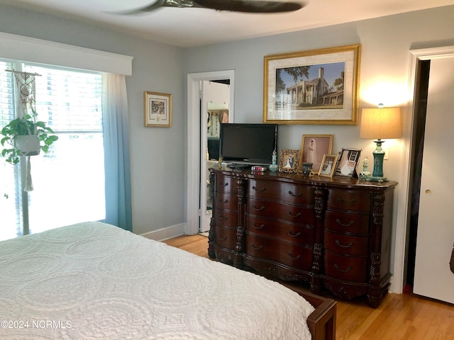 bedroom featuring ceiling fan and light hardwood / wood-style flooring