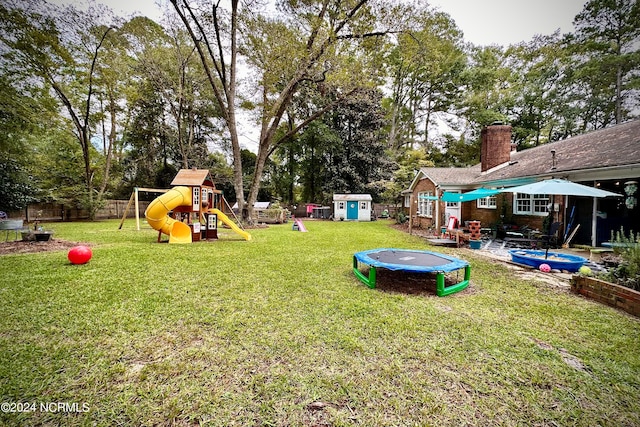 view of yard with a playground and a patio