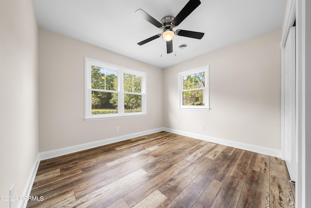 unfurnished bedroom featuring ceiling fan and hardwood / wood-style flooring