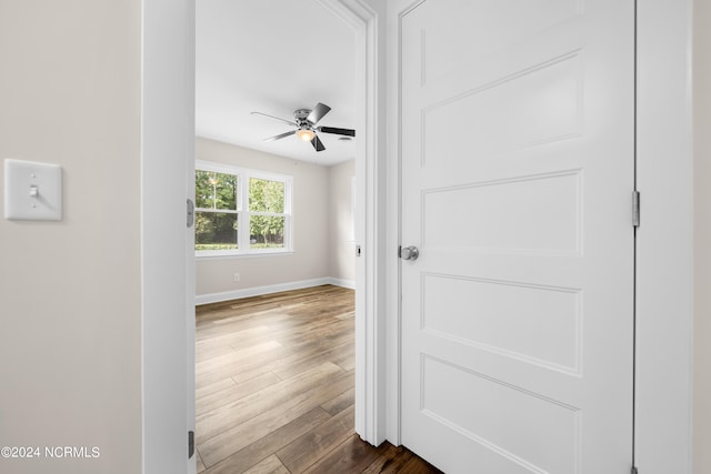 hallway featuring wood-type flooring