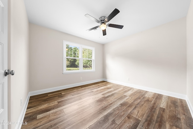 empty room featuring hardwood / wood-style flooring and ceiling fan