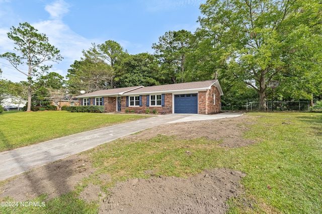 single story home featuring a front yard and a garage