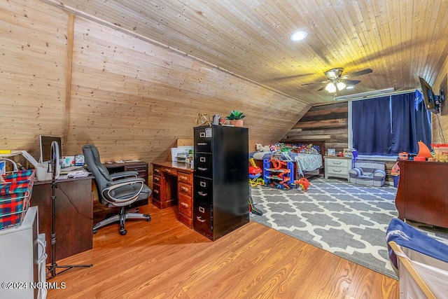 home office with lofted ceiling, wood ceiling, ceiling fan, wooden walls, and wood finished floors