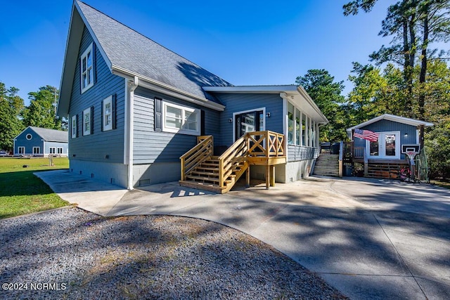 view of front of house featuring crawl space and roof with shingles