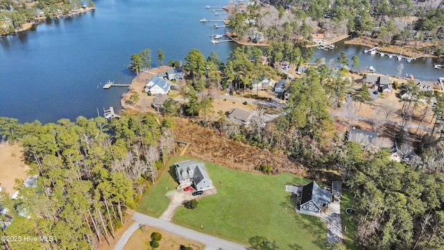 birds eye view of property with a water view