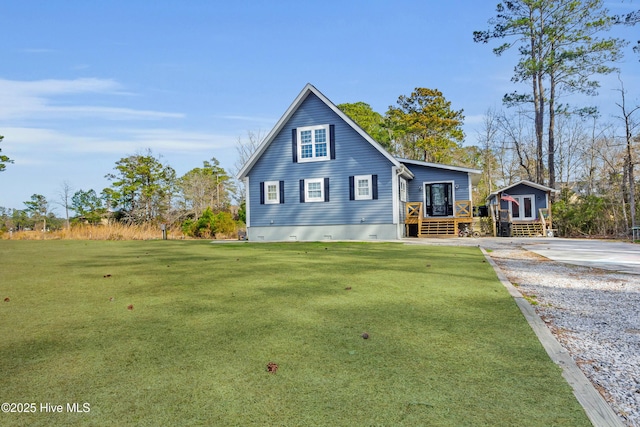 view of front of home with a deck, crawl space, and a front yard