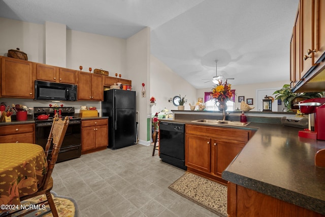 kitchen featuring black appliances, ceiling fan, sink, kitchen peninsula, and vaulted ceiling