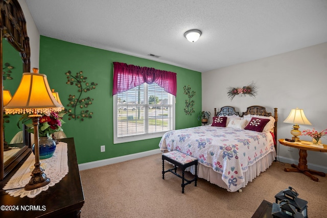 carpeted bedroom with a textured ceiling