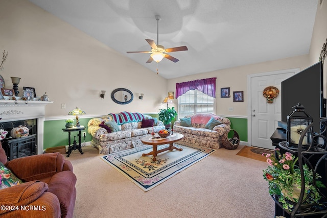 living room featuring ceiling fan, lofted ceiling, and carpet