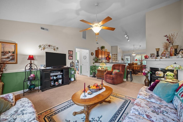 living room featuring high vaulted ceiling, carpet flooring, and ceiling fan