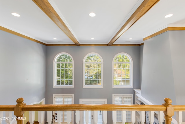 interior details with beam ceiling and ornamental molding