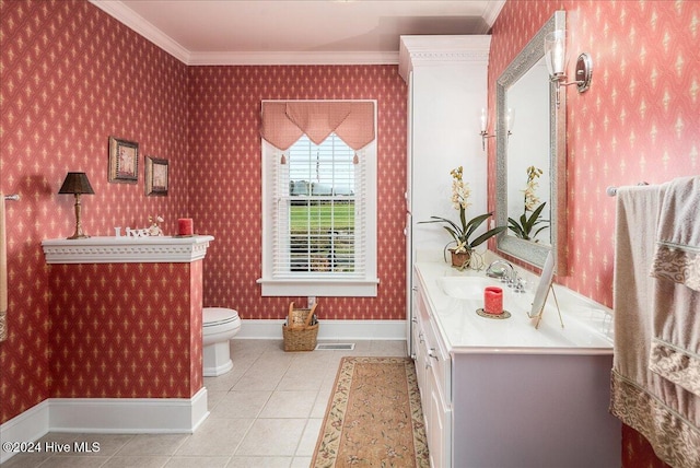 bathroom featuring vanity, tile patterned flooring, toilet, and ornamental molding