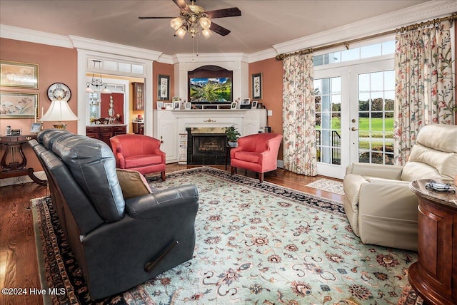 living room with ceiling fan, hardwood / wood-style floors, ornamental molding, and french doors