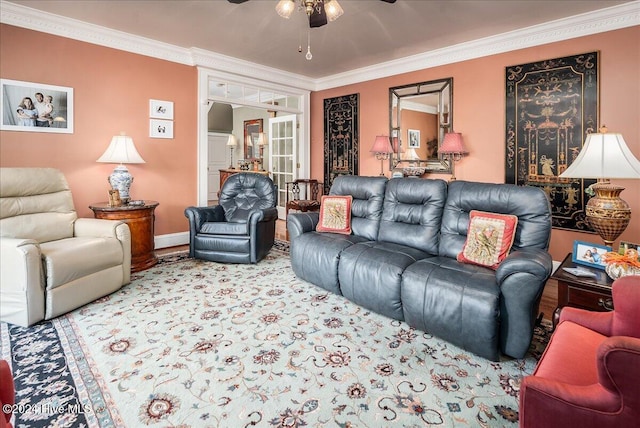 living room featuring ceiling fan and crown molding