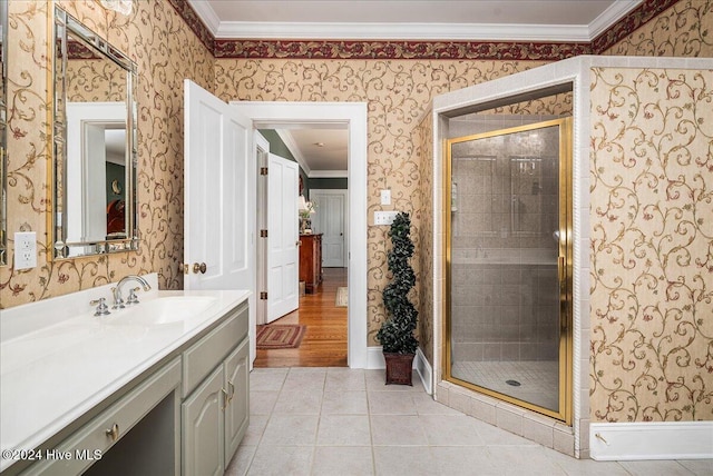 bathroom with tile patterned flooring, an enclosed shower, vanity, and crown molding