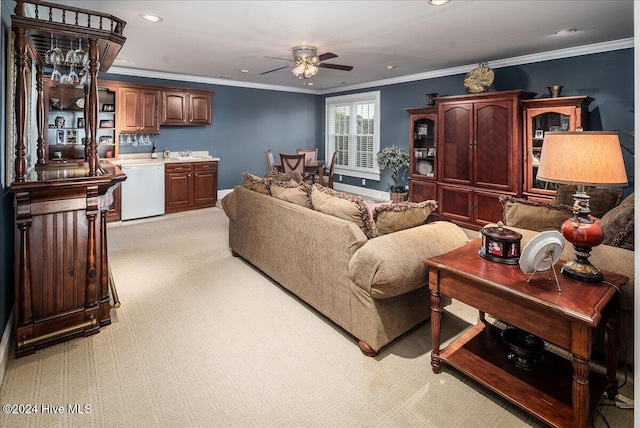 carpeted living room featuring ornamental molding and ceiling fan