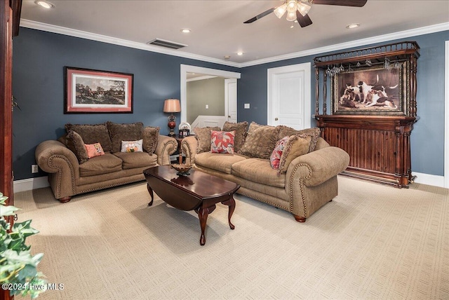 carpeted living room featuring ornamental molding and ceiling fan