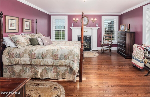 bedroom featuring crown molding and dark hardwood / wood-style flooring